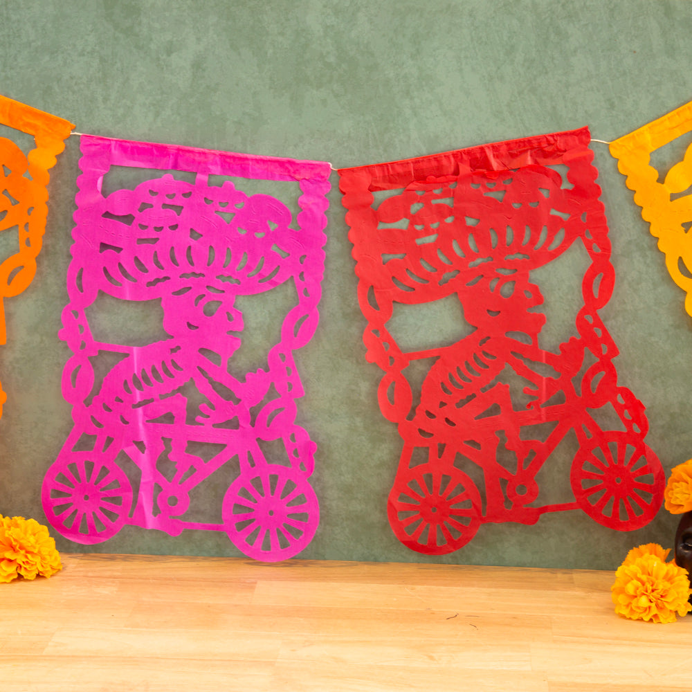 Colorful Calaca on a Bike Papel Picado Banner