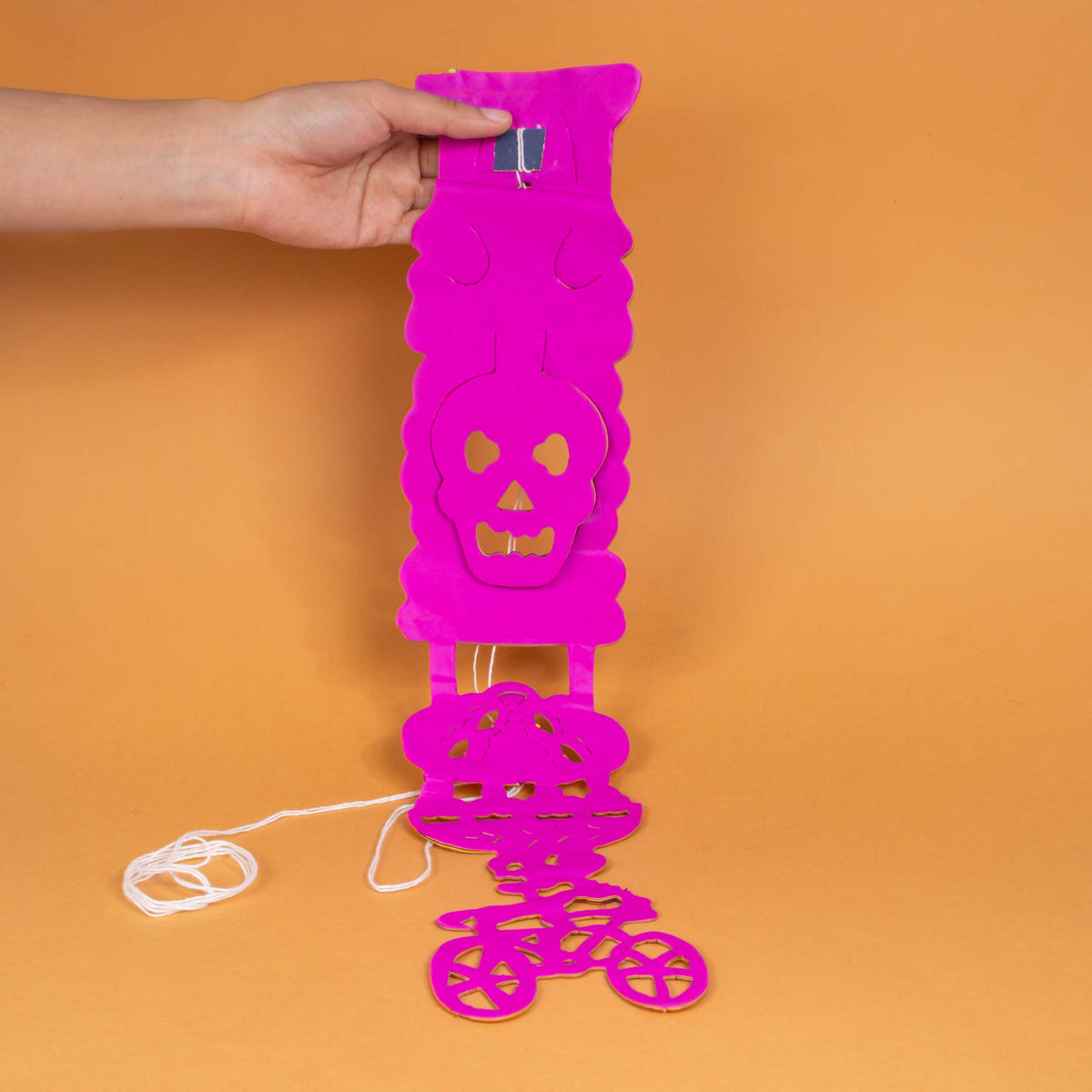 Colorful Calaca on a Bike Papel Picado Banner