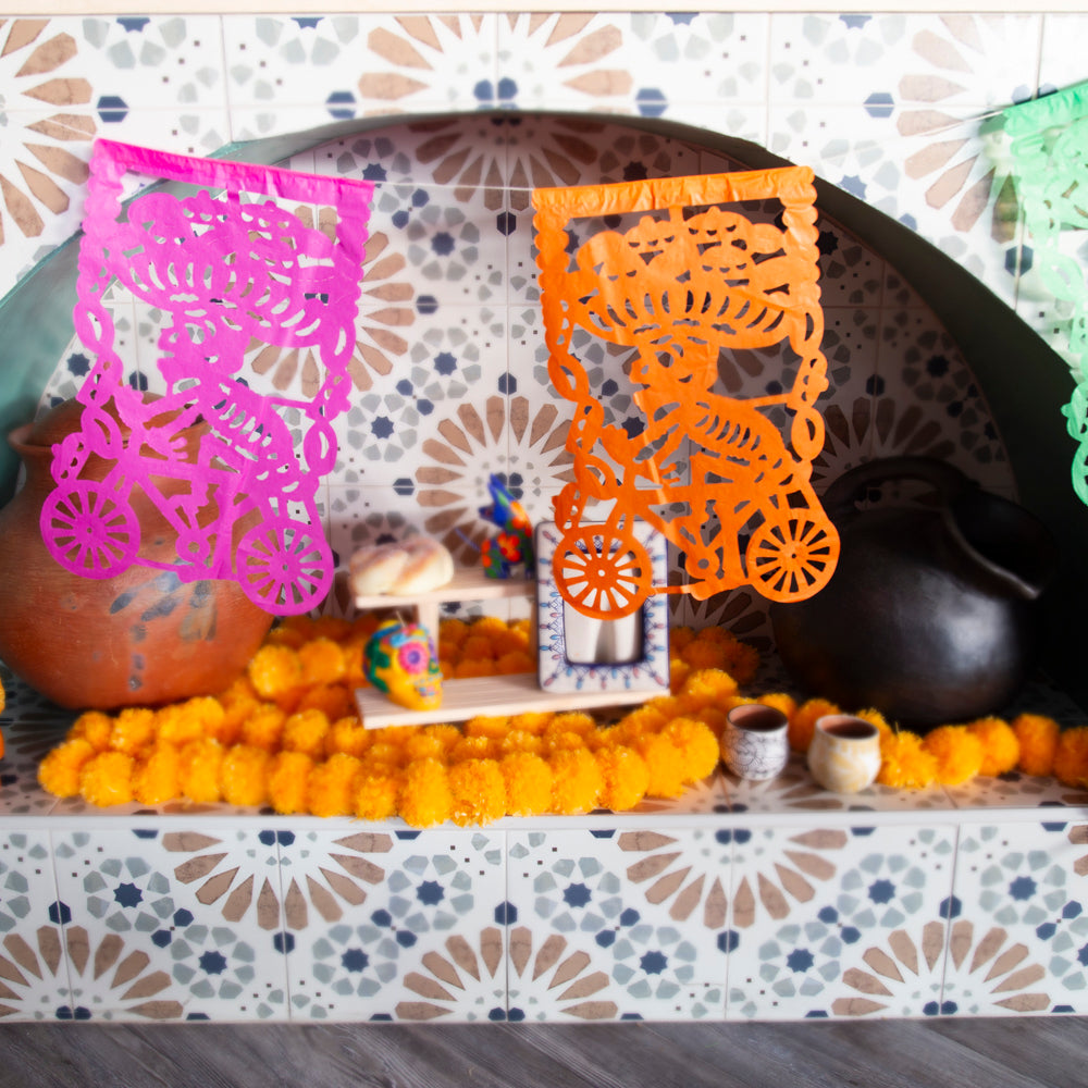 Colorful Calaca on a Bike Papel Picado Banner